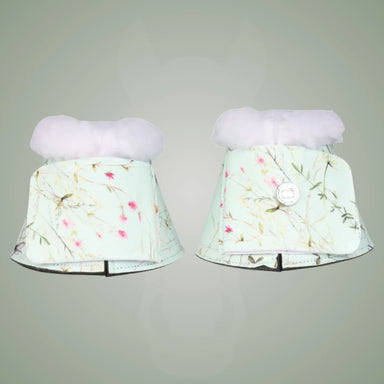 Pair of floral-patterned bell boots on a gray background