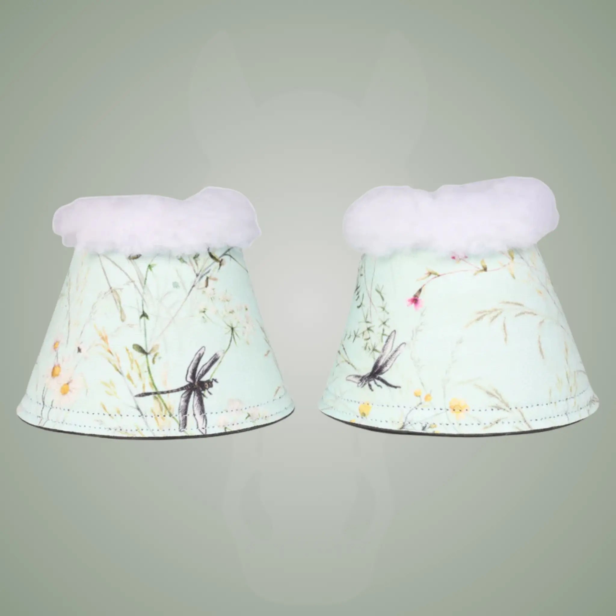 Pair of floral-patterned bell boots on a gray background