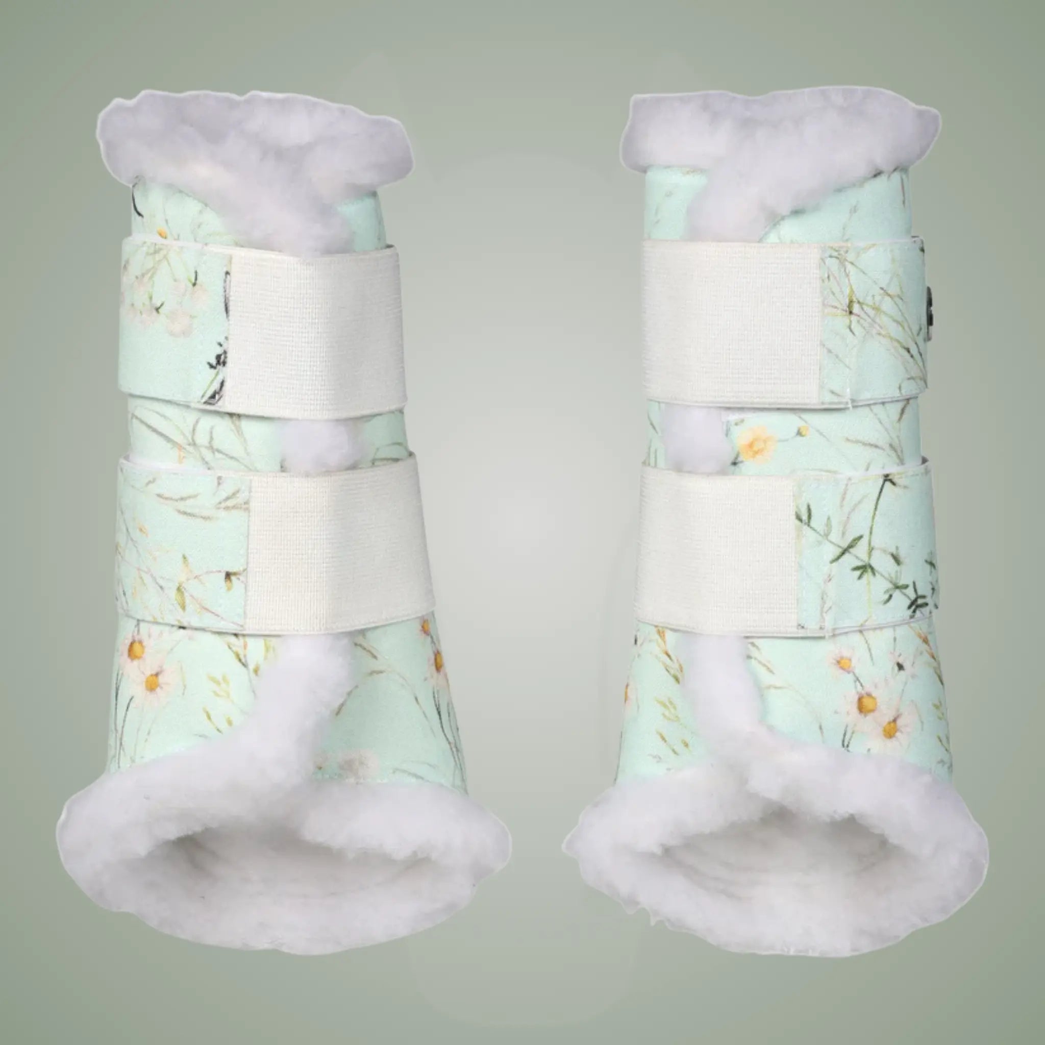 Pair of floral-patterned brush boots on a gray background