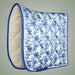 Blue and white quilted saddle pad on a gray background