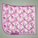 Pink and white quilted saddle pad with horse pattern on a gray background