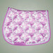 Pink and white patterned saddle pad on a gray background
