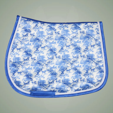 Blue and white patterned saddle pad on a gray background