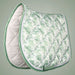 Green and white quilted saddle pad on a gray background