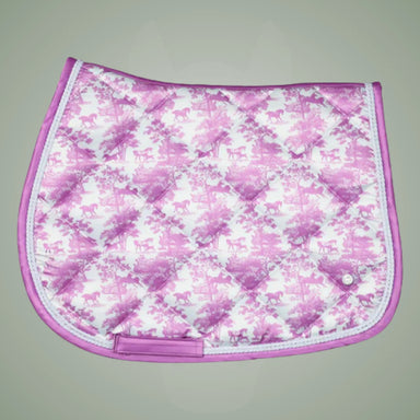 Pink and white floral patterned saddle pad on a gray background