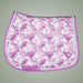 Pink and white floral patterned saddle pad on a gray background