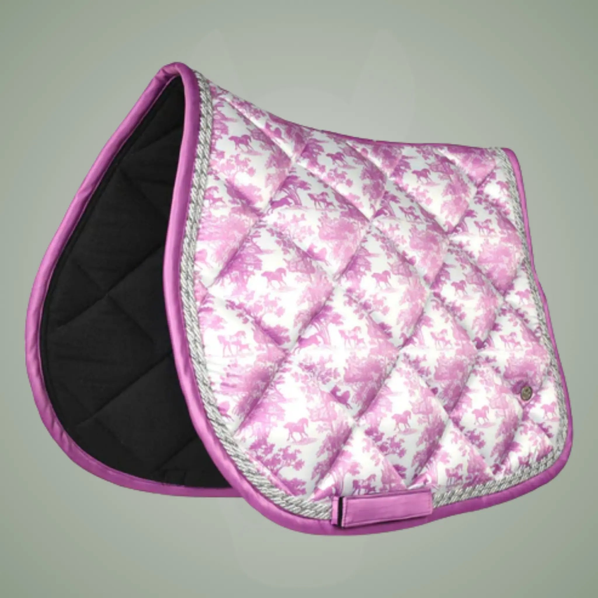 Pink floral patterned saddle pad on a gray background
