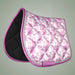 Pink floral patterned saddle pad on a gray background