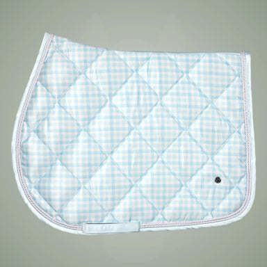 Quilted saddle pad with blue and white check pattern on a gray background
