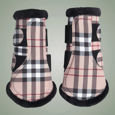 Pair of plaid horse boots with black trim on a light gray background