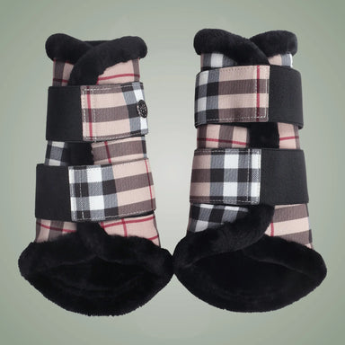 Pair of plaid protective booties with black straps on a light green background