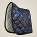 Quilted saddle pad with galaxy pattern on a beige background