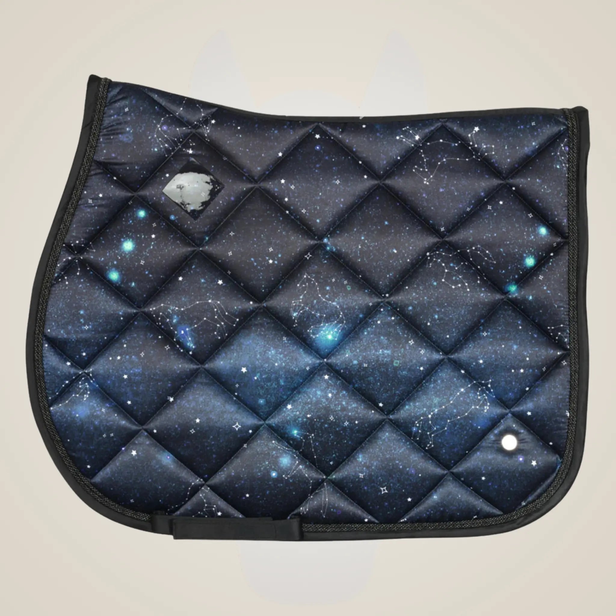 Saddle pad with starry night pattern on a beige background.