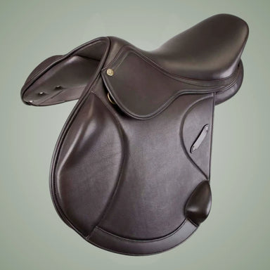 Brown leather saddle on a light green background