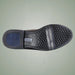Shoe sole with brand logo on a light green background