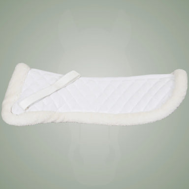 White sheepskin saddle pad on a gray/green background