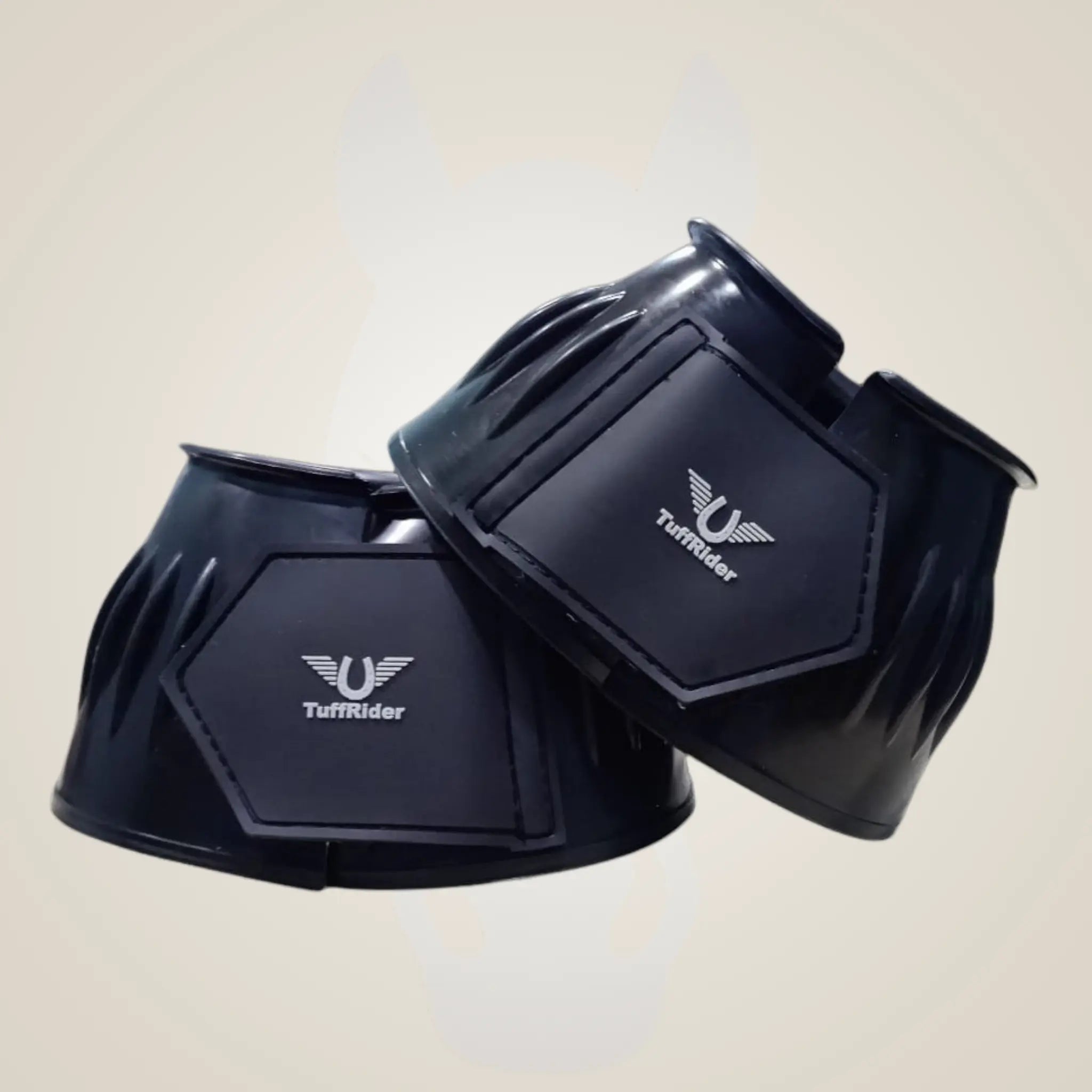 Black horse boots with TuffRider logo on a beige background