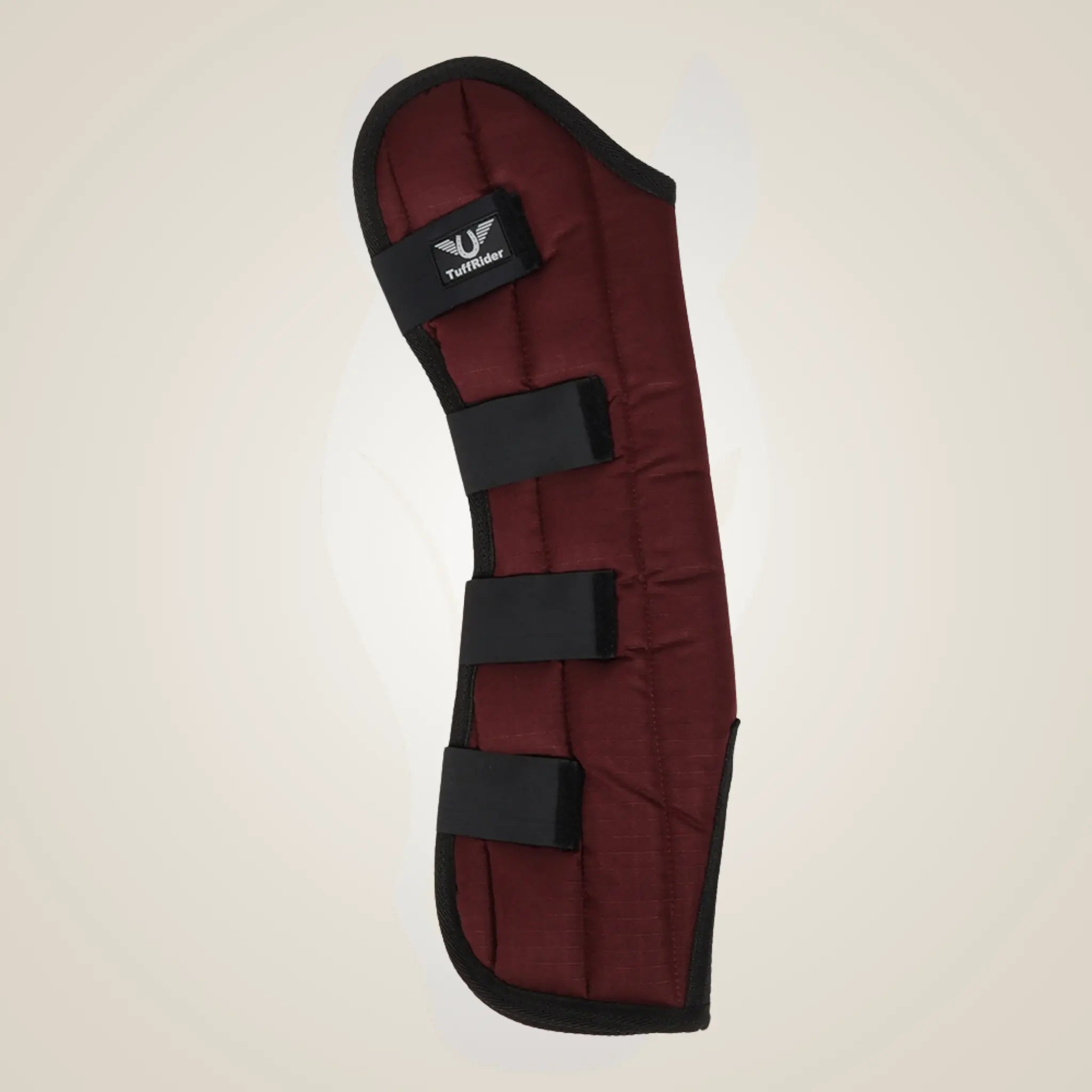 Red protective pad with black straps on a beige background