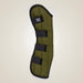 Green protective pad with black straps on a beige background