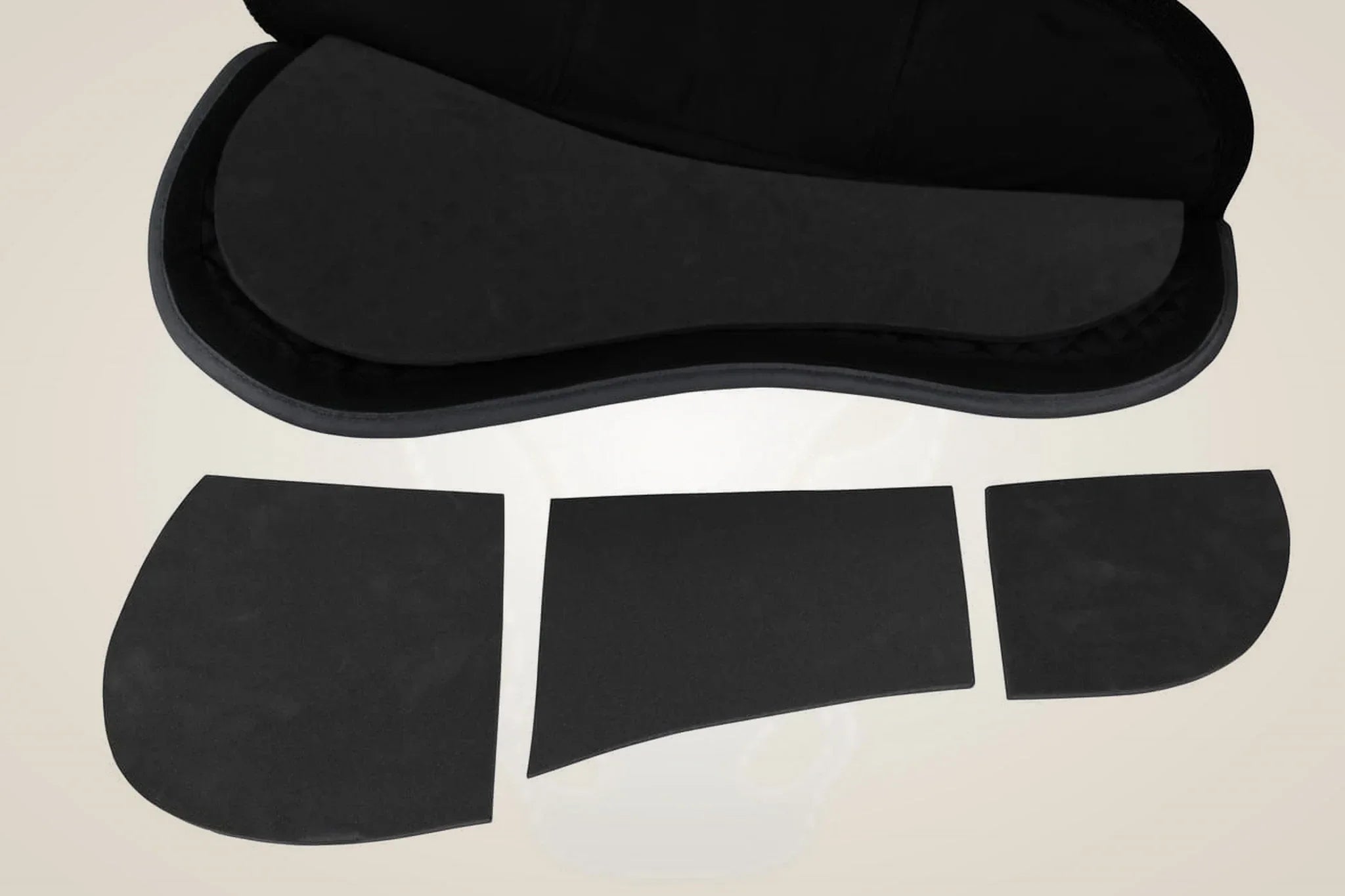 Bagari Protec Plus pad in black with its three shim inserts laid out.