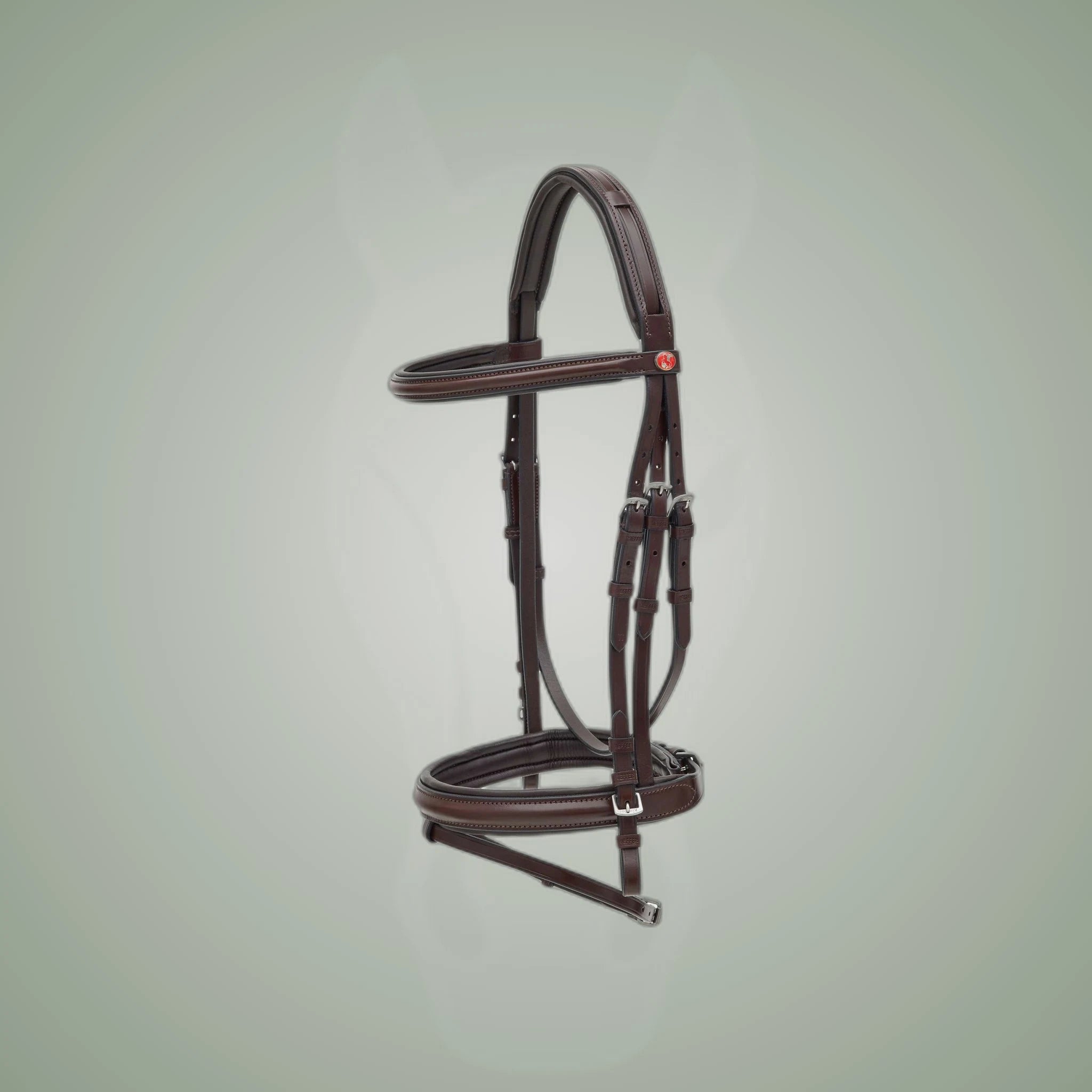 Kieffer Ergonomic Line Snaffle Bridle on One-Eyed Equine branded background
