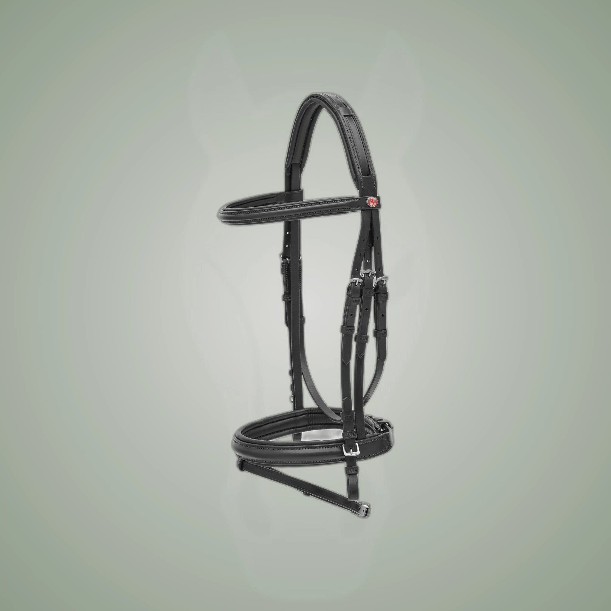 Kieffer Ergonomic Line Snaffle Bridle on One-Eyed Equine branded background