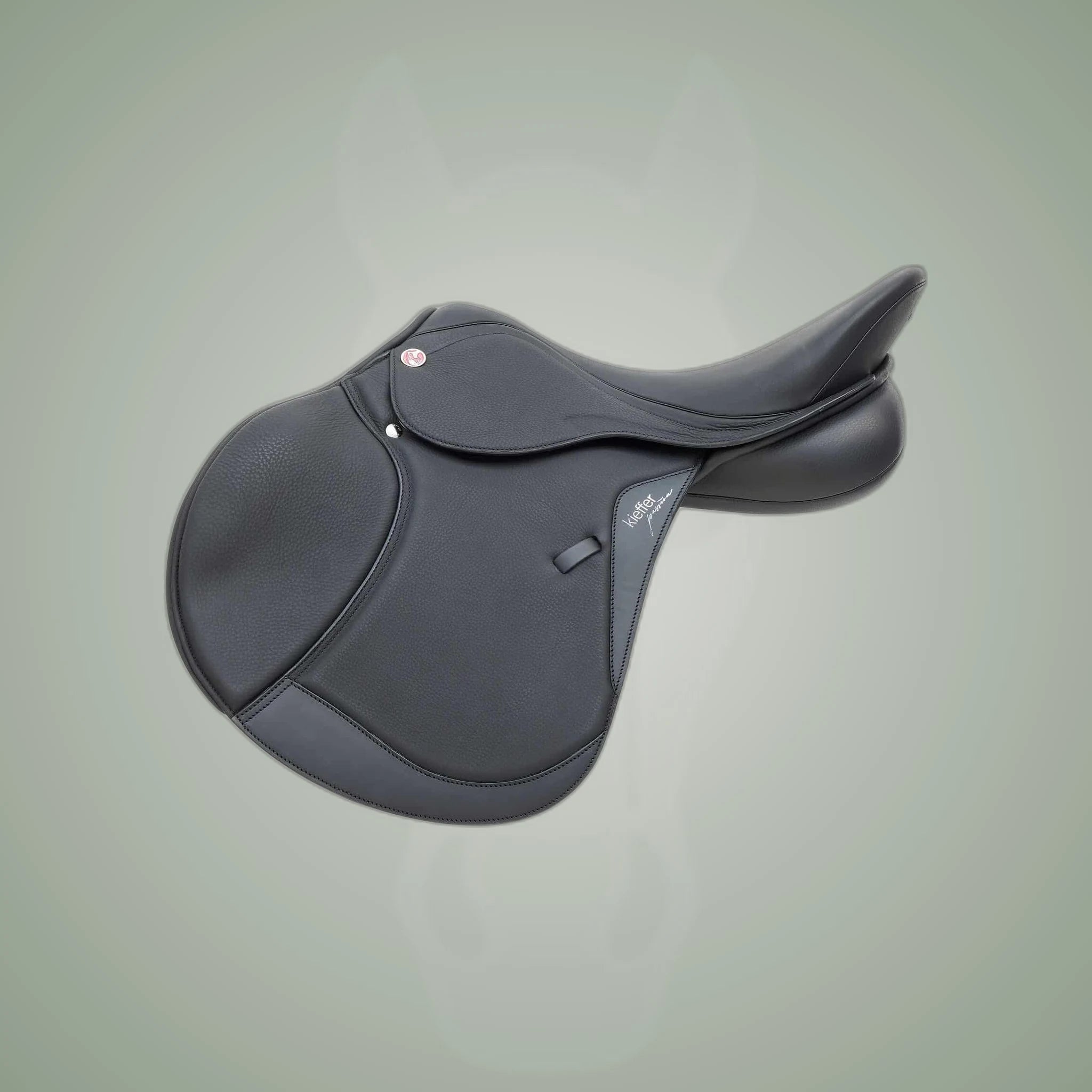 Kieffer Passion Four Jump Saddle on One-Eyed Equine branded background